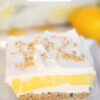 slice of layered lemon dessert with text overlay "Lemon Lush".
