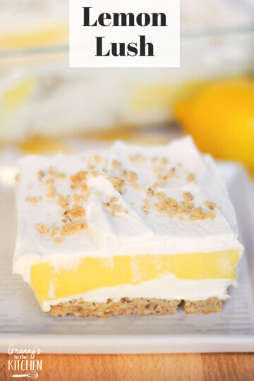 slice of layered lemon dessert with text overlay "Lemon Lush".