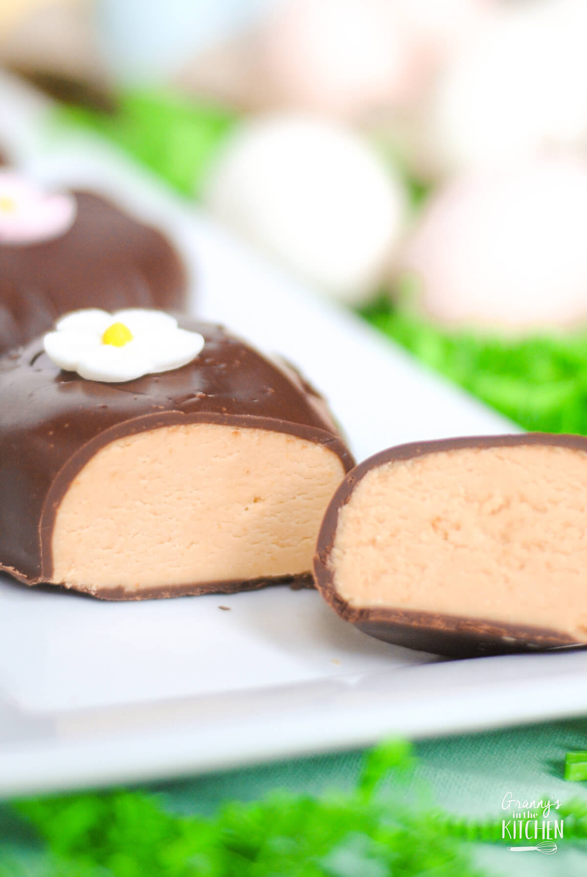 chocolate covered peanut butter eggs, one cut open.