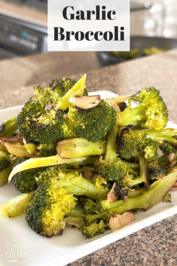 plate of sauteed broccoli with text overlay "Garlic Broccoli".