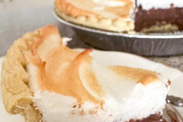 slice of chocolate pie with text overlay "Chocolate Meringue Pie".