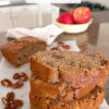 slices of homemade apple quick bread stacked on counter, with text overlay "Apple Bread".