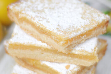 stack of homemade lemon bars, text overlay "Lemon Squares".