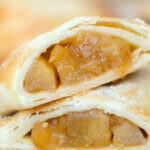 apple hand pie, cut in half, to show detail.