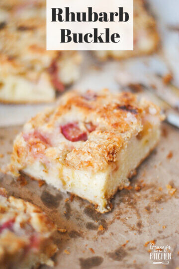 close up of a slice of rhubarb cake; text overlay "Rhubarb Buckle".