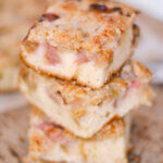 stack of 3 pieces of a rhubarb cake.