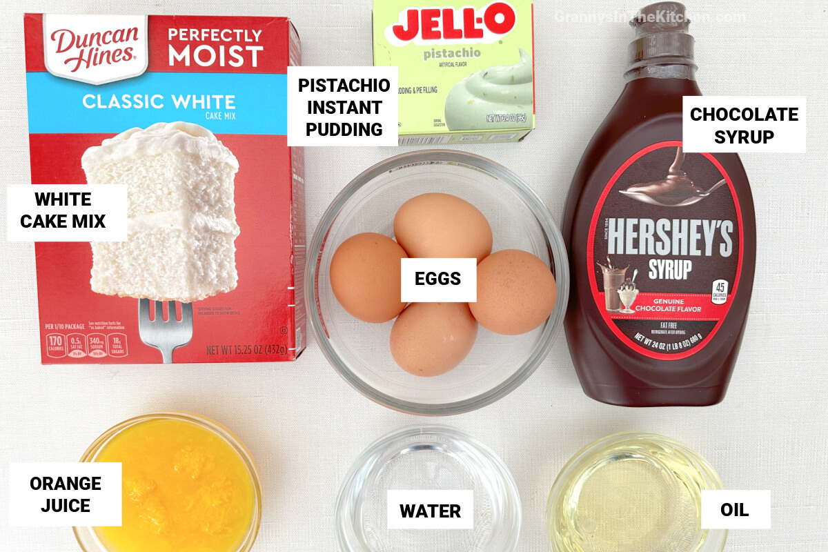 ingredients to make chocolate pistachio cake, with text labels.