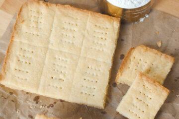 top down view of shortbread on parchment paper; text overlay "Scottish Shortbread."