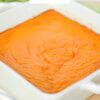 baking dish with carrot casserole; text overlay "Carrot Soufflé".