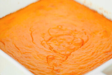 baking dish with carrot casserole; text overlay "Carrot Soufflé".