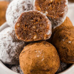 Rum Balls in a bowl with one cut in half