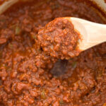 pot of no bean chili with wooden spoon.