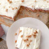 top down view of a soda cracker torte, with one slice on plate.