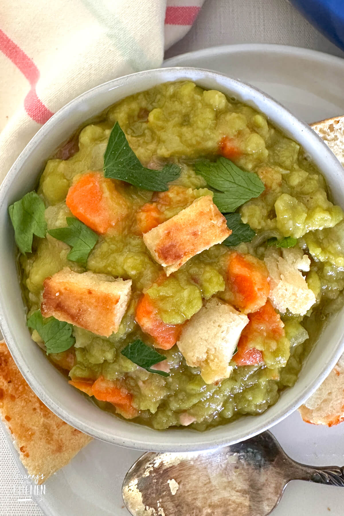 top down view of a bowl of split pea and ham soup.
