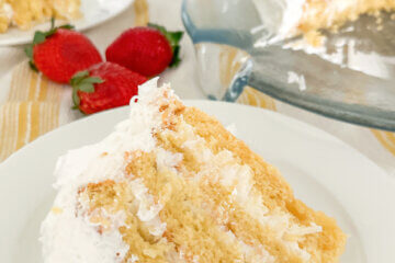 slice of cake, with text overlay of recipe name "Coconut Icebox Cake".