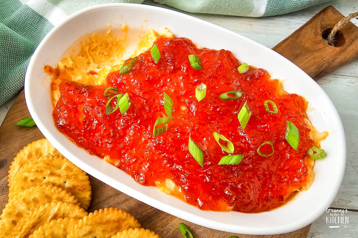 Red pepper cream cheese dip in a white bowl