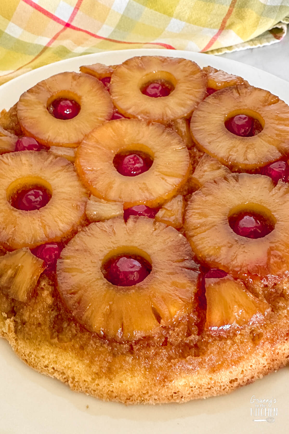 close up of a pineapple upside down cake.