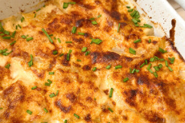 Turnips au Gratin in casserole dish, with text overlay of recipe name.