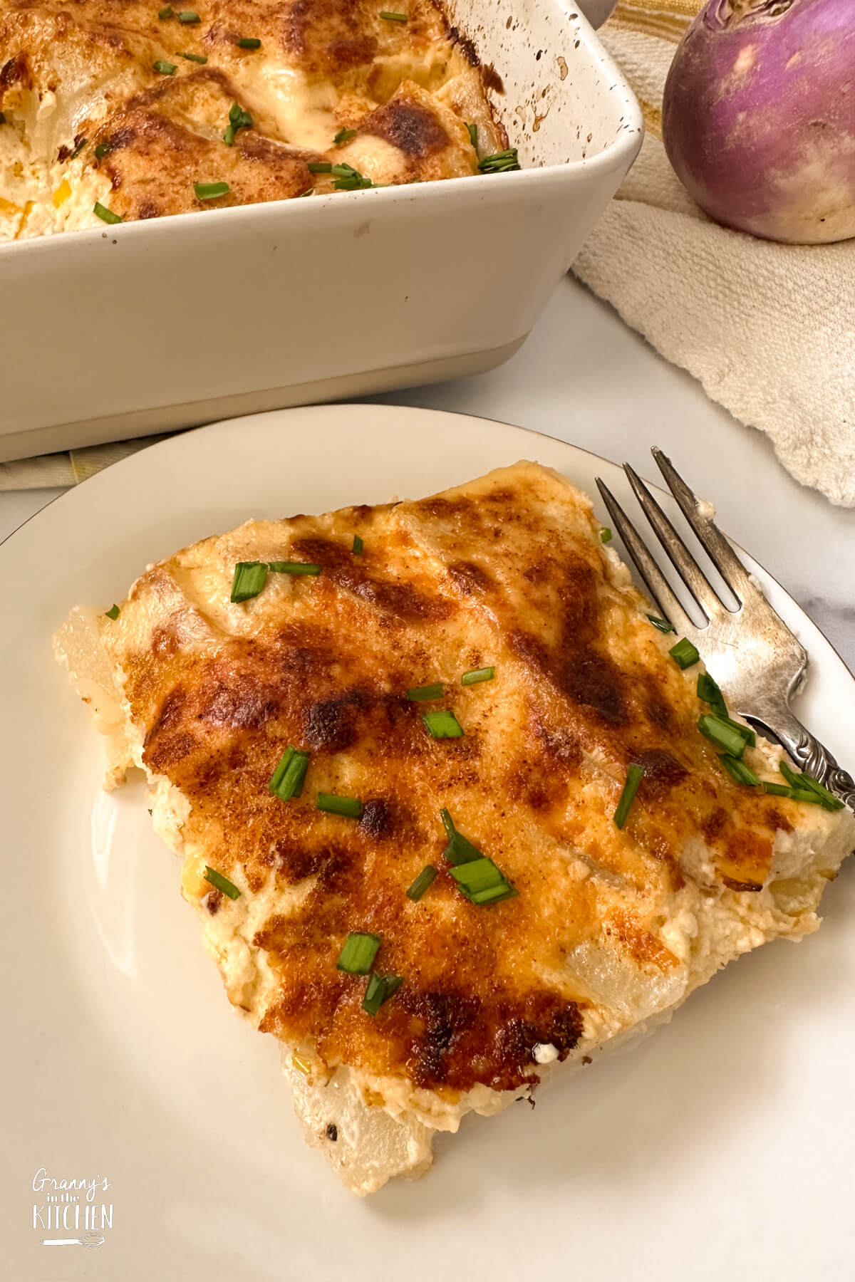 close up of a serving of turnip au gratin.