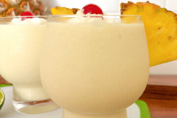 frozen cocktails with text overlay "Classic Piña Coladas"