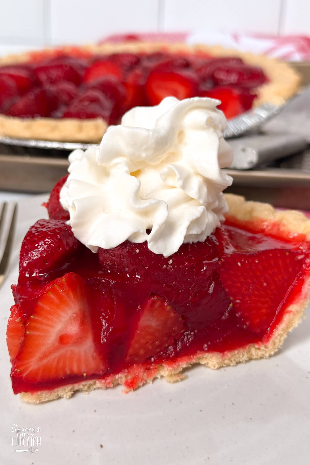 close up of a slice of strawberry pie.