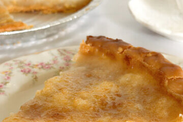 close up of a slice of custard-style pie with ext overlay "Water Pie."