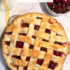 top down photo of a homemade cherry pie, with text overlay of recipe name.