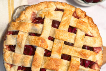 top down photo of a homemade cherry pie, with text overlay of recipe name.