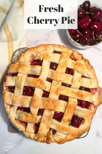 top down photo of a homemade cherry pie, with text overlay of recipe name.