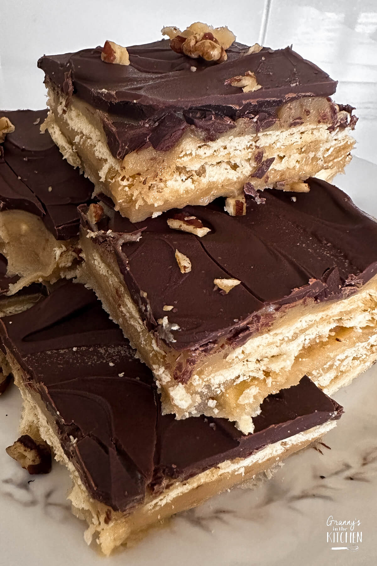 layered saltine toffee bars topped with chocolate.