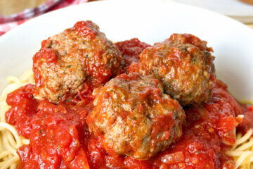 bowl of spaghetti and meatballs, text overlay "Italian Meatballs."