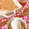 apple crisp in bowl with ice cream and in the pan, with text overlay of recipe name.