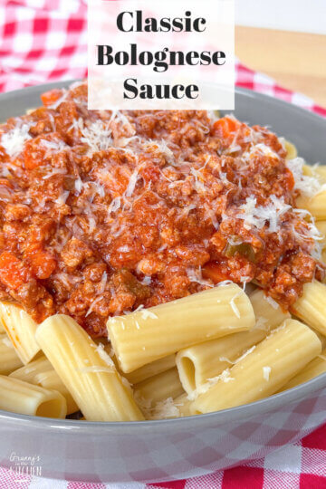 bowl of rigatoni with meat sauce, text overlay "Classic Bolognese Sauce."