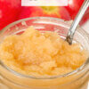 close up of a jar of applesauce, text overlay "Homemade Applesauce."