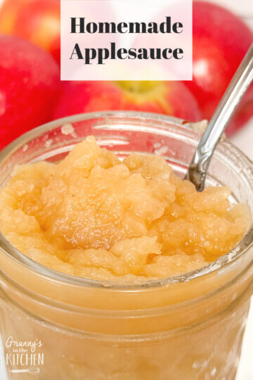 close up of a jar of applesauce, text overlay "Homemade Applesauce."