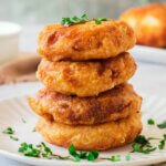 A stack of Potato Fritters on a plate.