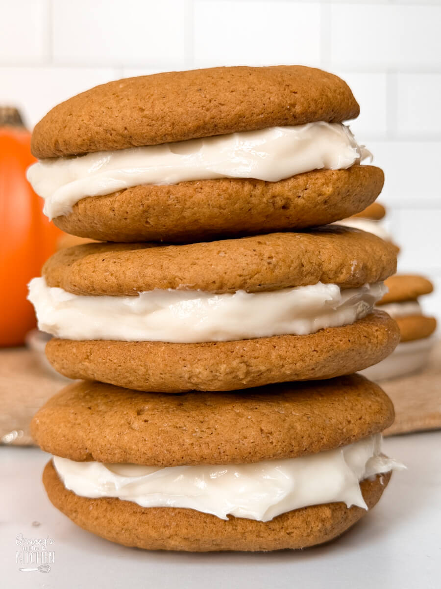 a stack of 3 homemade pumpkin whoopie pies.