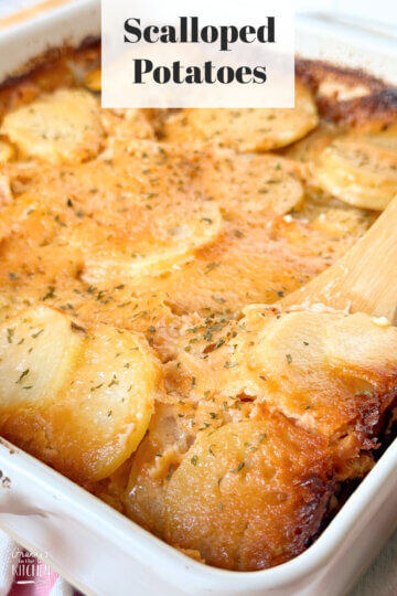 pan of scalloped potatoes with text overlay of recipe name.