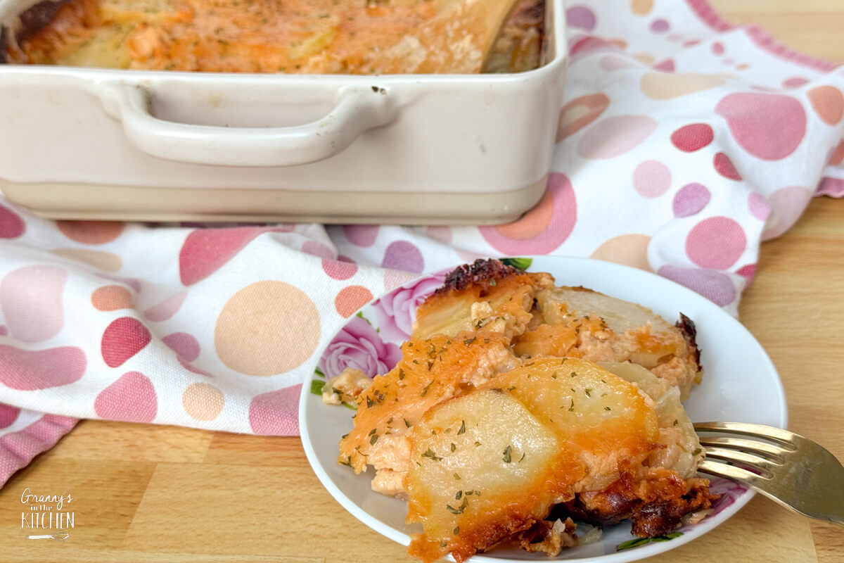scalloped potatoes on plate and in a dish.