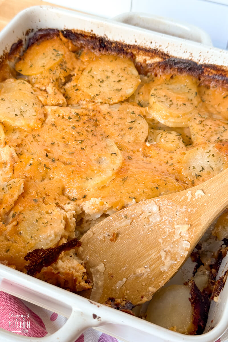 casserole dish of cheesy scalloped potatoes.