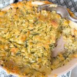 top down view of a zucchini casserole, with a serving spoon.
