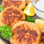 salmon patties on a plate, with text overlay "Salmon Patties"