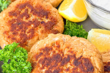 salmon patties on a plate, with text overlay "Salmon Patties"
