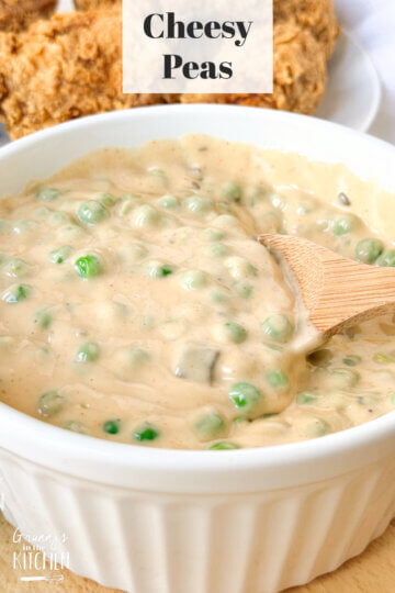 a bowl of peas in a thick and creamy cheese sauce; text overlay "Cheesy Peas."
