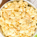 top-down view of a bowl of egg salad with text overlay "Classic Egg Salad."