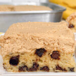 a slice of cake with chocolate chips and peanut butter frosting; text overlay "Chocolate Chip Banana Cake"