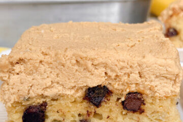 a slice of cake with chocolate chips and peanut butter frosting; text overlay "Chocolate Chip Banana Cake"