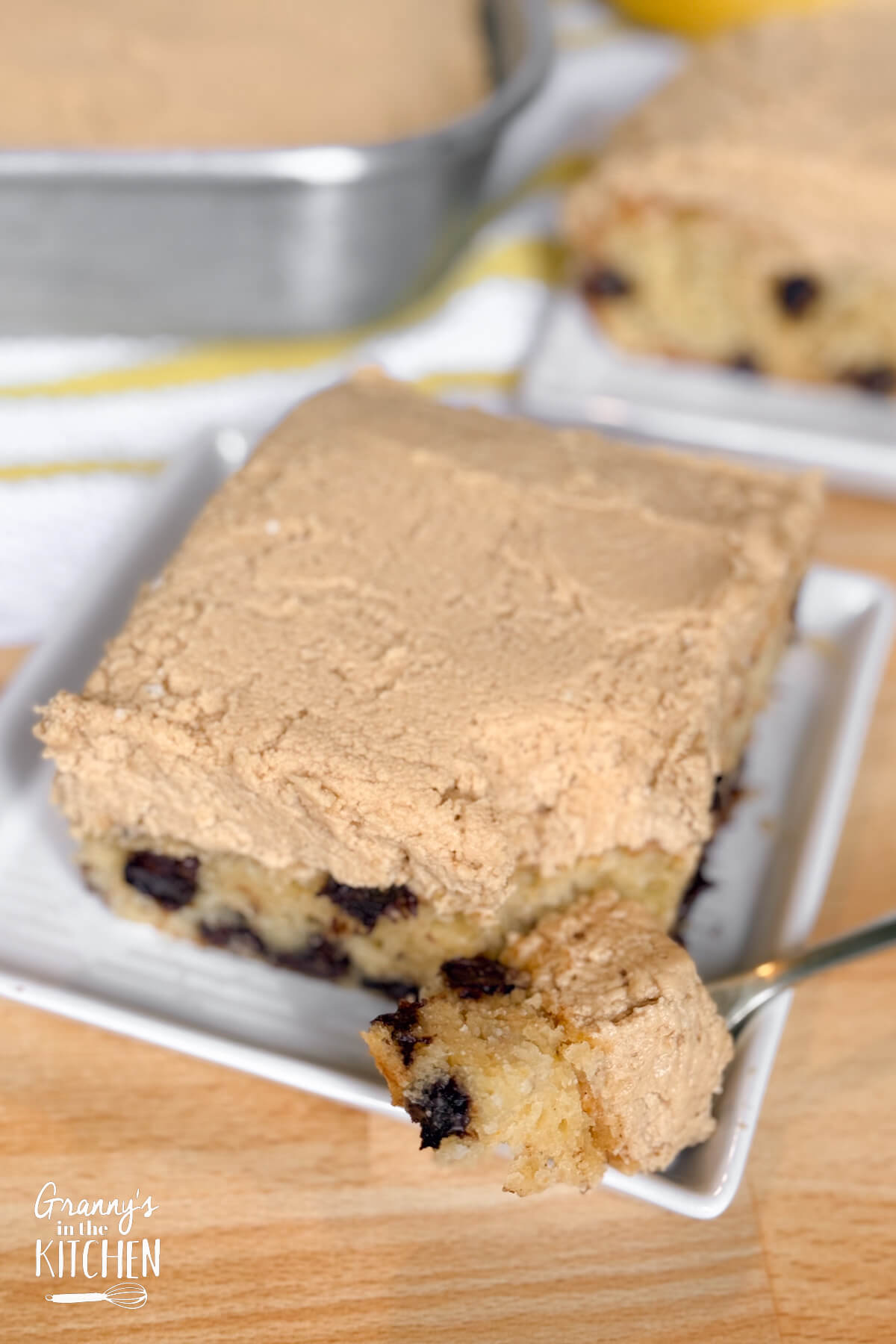 a slice of cake topped with peanut butter frosting.