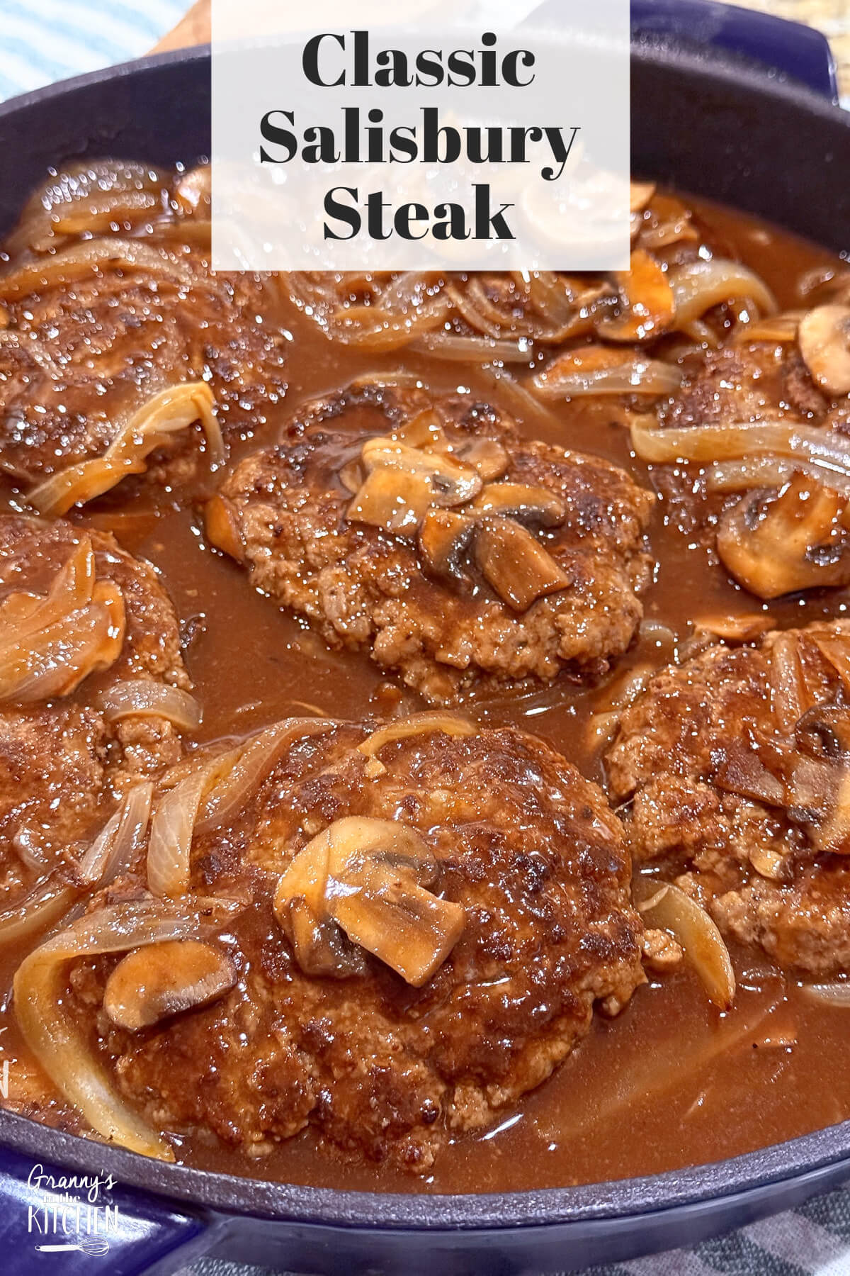 skillet with homemade hamburger steak and gravy; text overlay "Classic Salisbury Steak"