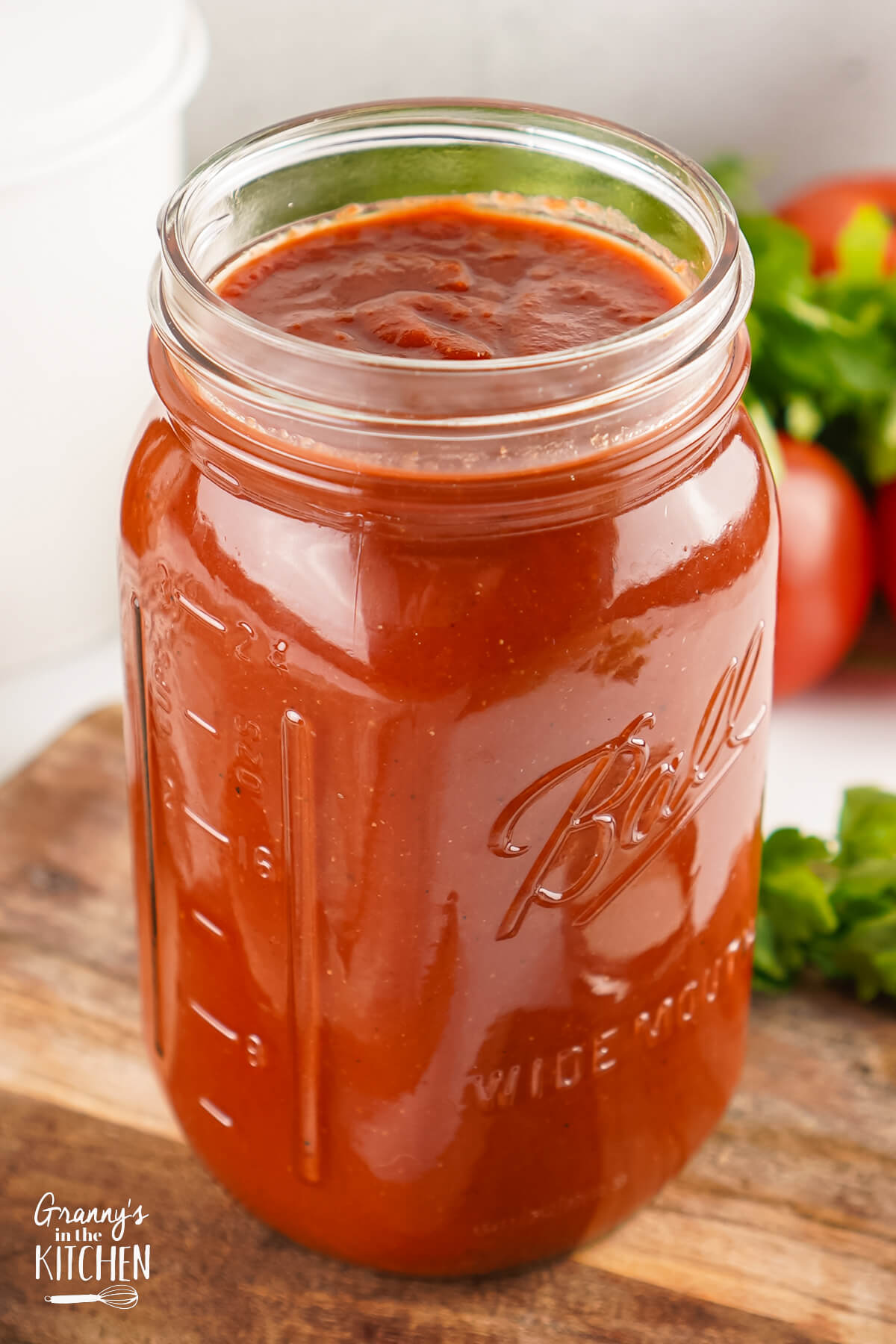 A ball jar full of Homemade Ketchup.